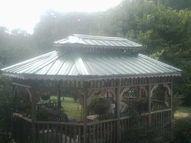 Two tier green metal roof on a garden gazebo in Middleburg